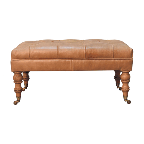 Tan buffalo leather ottoman with solid mango wood base, deep-buttoned top, and light walnut hand-turned feet. 360 degree GIF