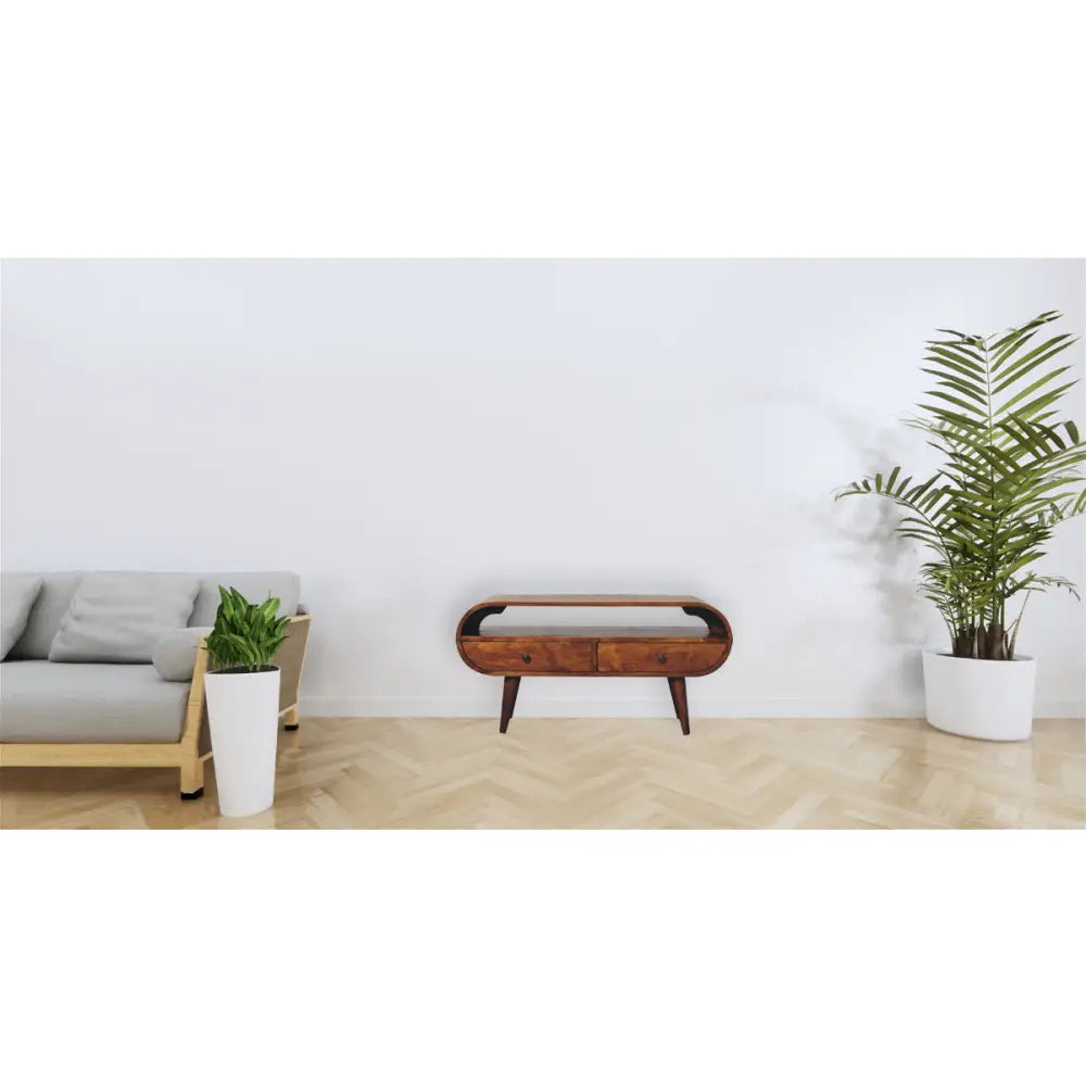 Chestnut Circular TV Stand made from solid mango wood with 2 drawers, open slot, and Nordic-style legs. Positioned in a living room space.