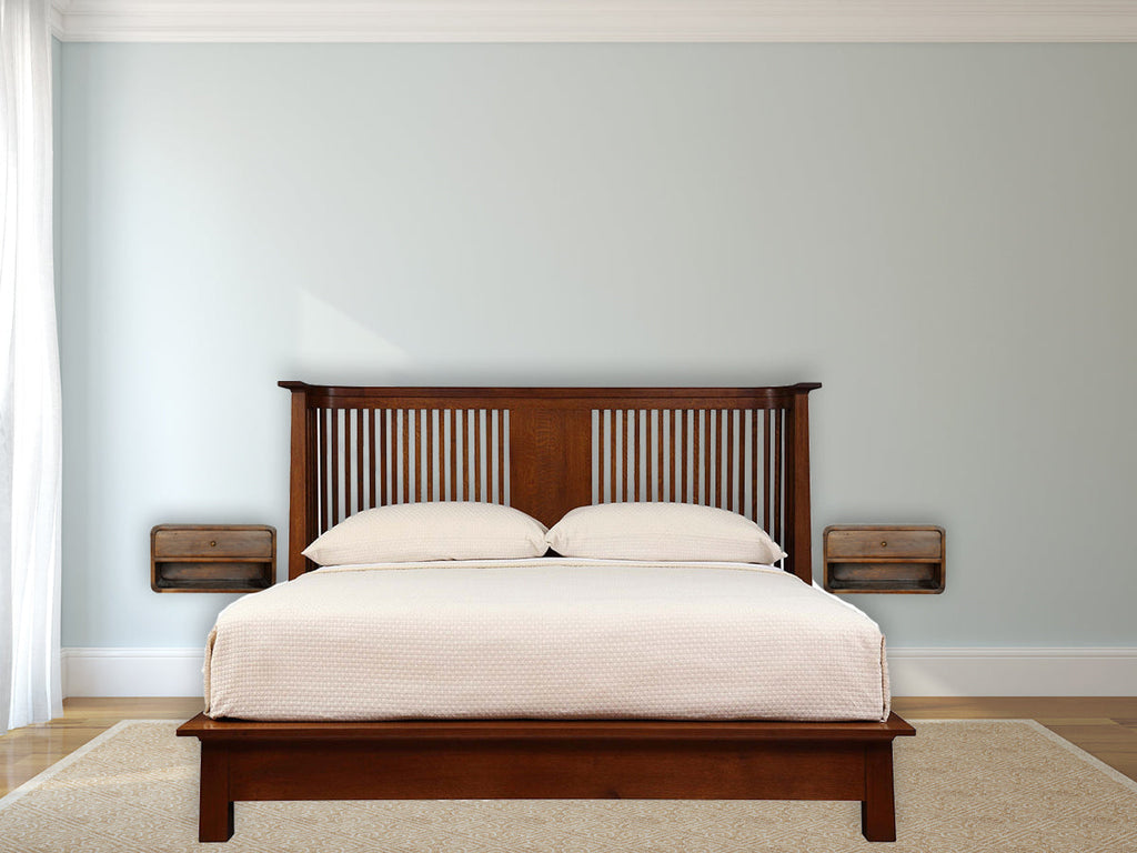 Floating chestnut nightstand with curved edges, wall-mounted modern design. Nightstands beside a bed in a bedroom.