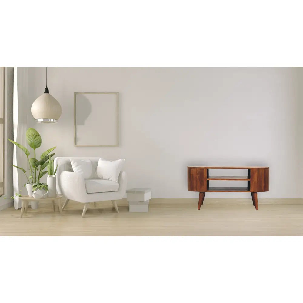 Cortez Chestnut Media Unit made from solid mango wood with two open shelves and chestnut finish. Full view in a living space