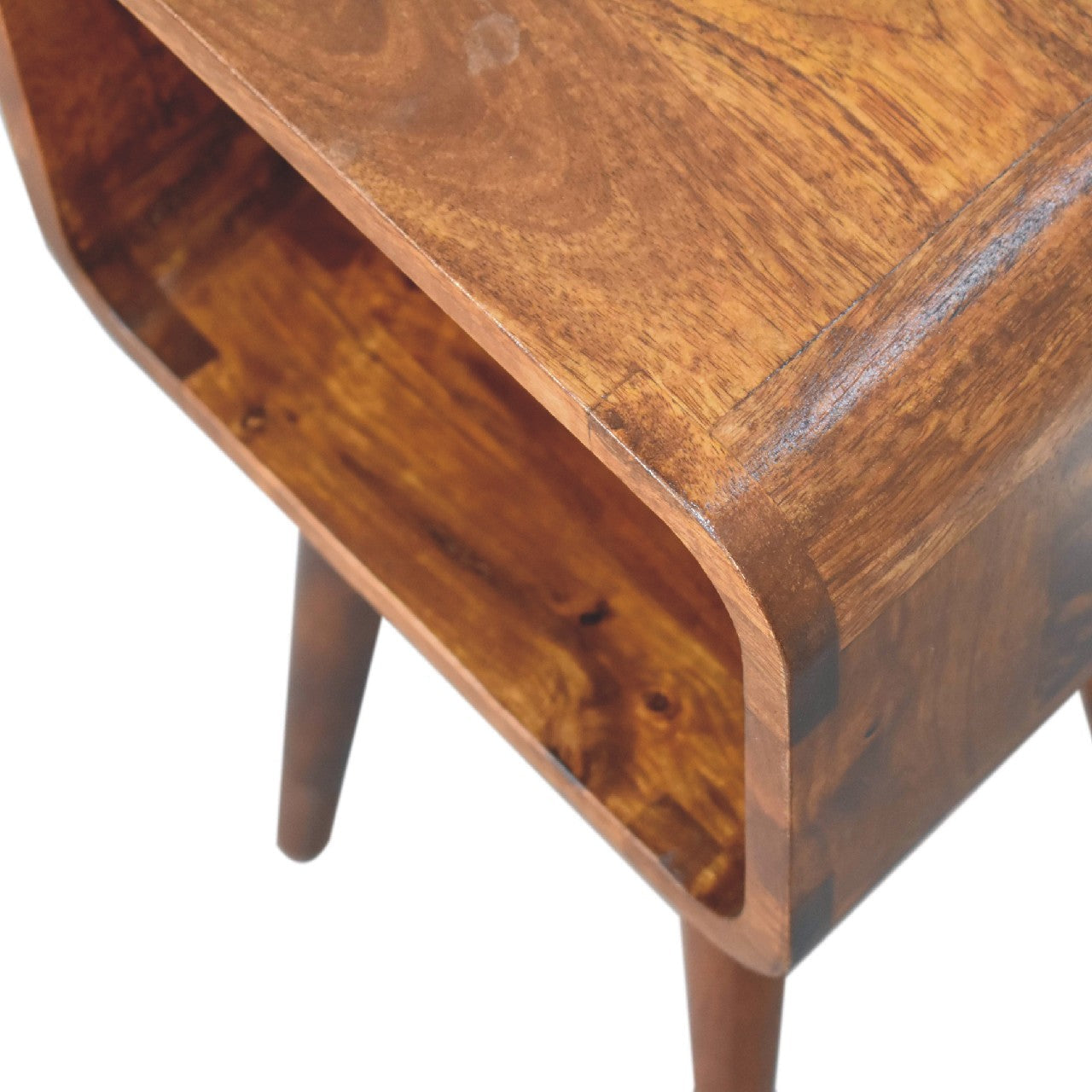 Mini Chestnut Open Nightstand made from solid mango wood with four tapered legs and one open storage compartment. smooth edge view
