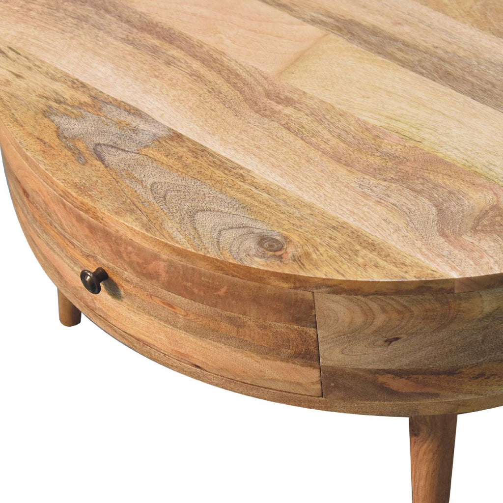Odyssey Oak-ish Coffee Table made from solid mango wood with circular design and drawer with brass knob. Top view of table and knob view