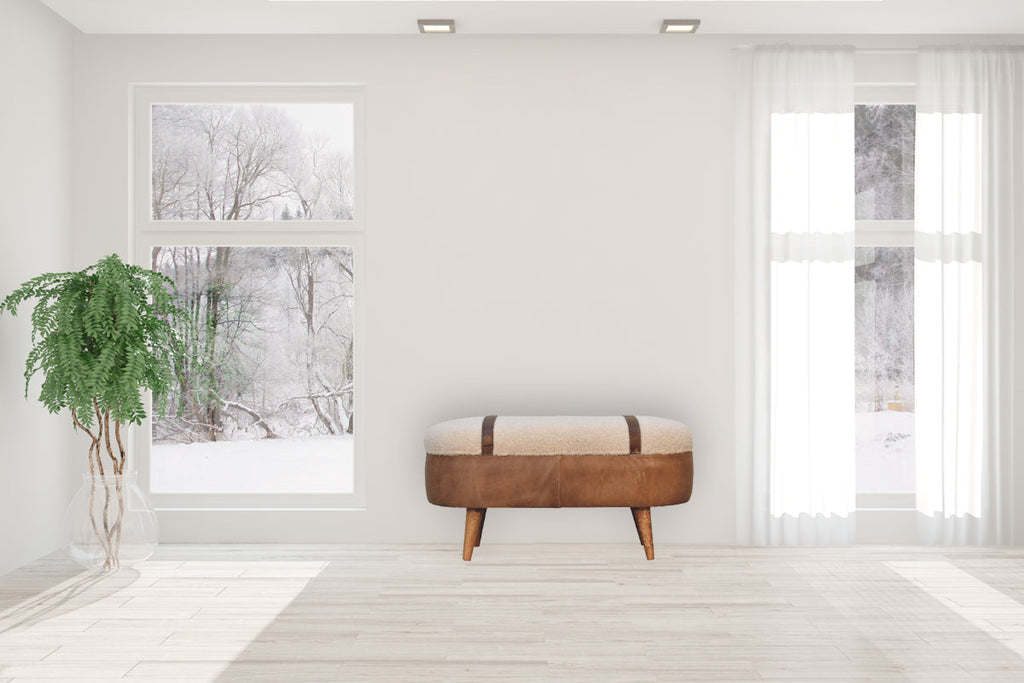 Tan Boucle and Buffalo Leather Bench with cotton boucle seat, leather straps, and oak finish legs. Furniture in a living room view